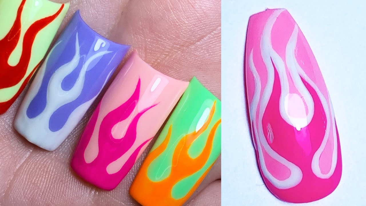 Flame Nail Ideas - MARBLE ART WITH RED FLAMES The last nail idea is another  one that combines two must-have nail trends. Here we have pink marble nails  with red flame outlines